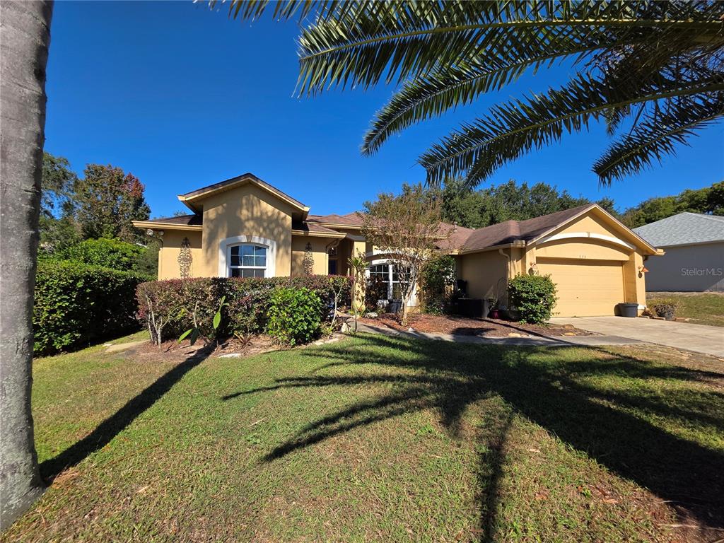 686 Park Valley Circle Minneola, FL 34715 - Photo 3 of 33 a view of a house with a swimming pool