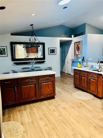 a kitchen with stainless steel appliances granite countertop a stove and a sink