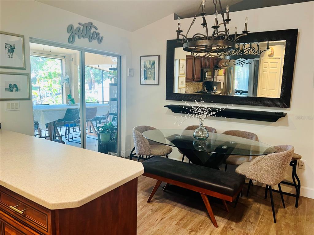 686 Park Valley Circle Minneola, FL 34715 - Photo 10 of 33 a room with chandelier furniture and windows