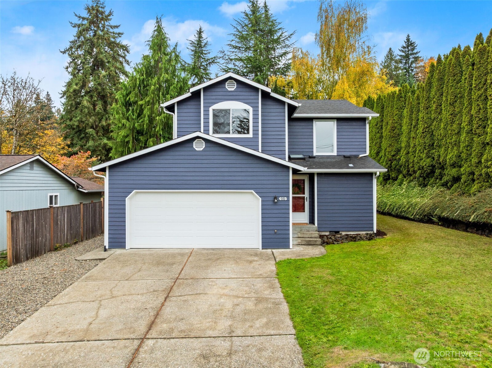 a front view of a house with yard