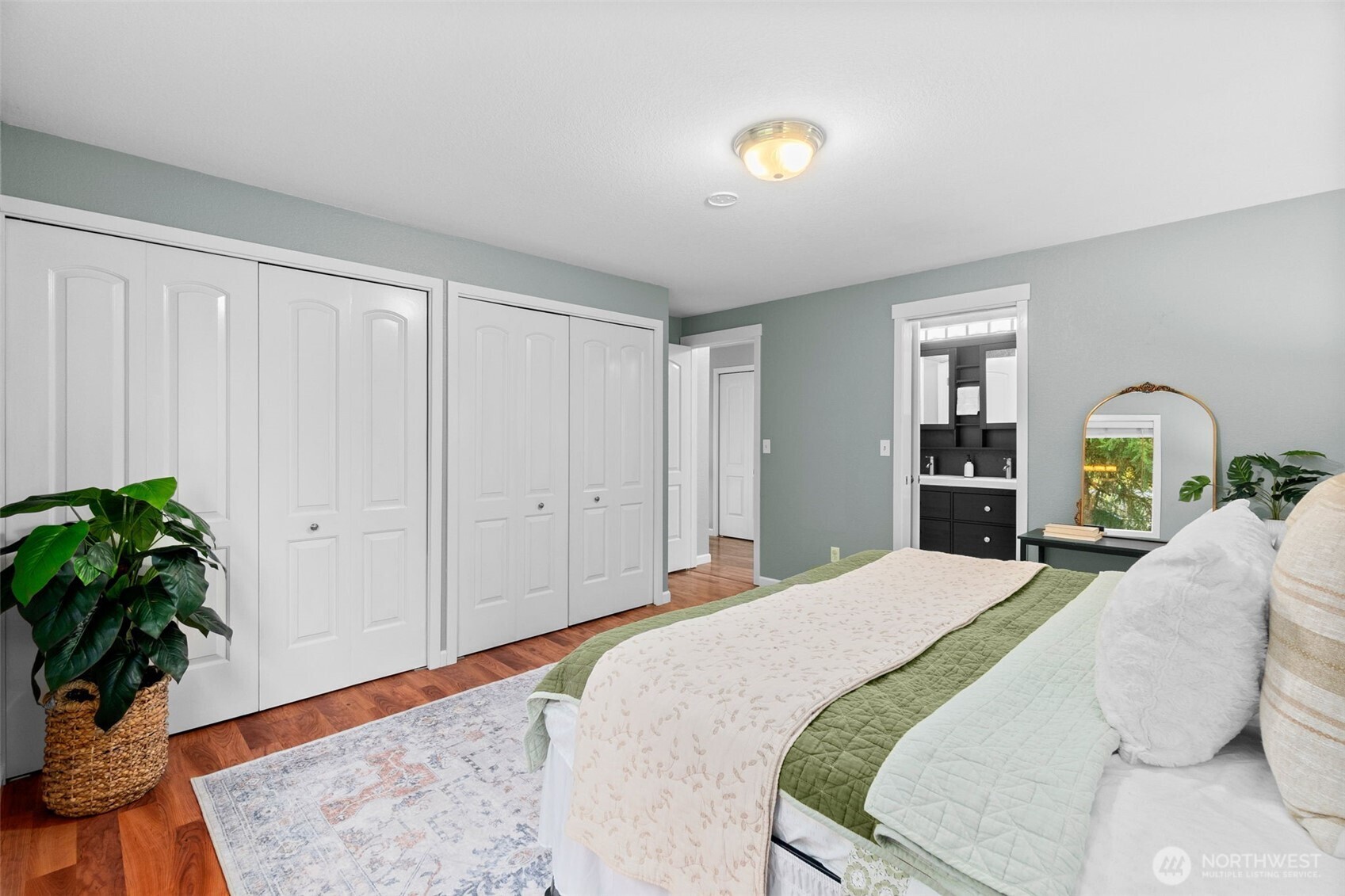 615 Clark Street Southwest Tumwater, WA 98512 - Photo 20 of 27 a bedroom with a bed and a potted plant