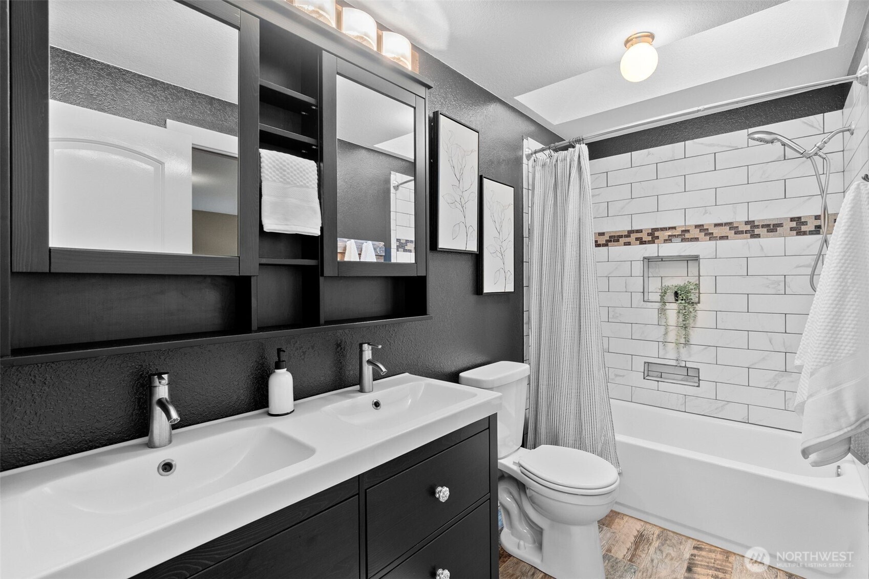 615 Clark Street Southwest Tumwater, WA 98512 - Photo 21 of 27 a bathroom with a double vanity sink toilet and shower