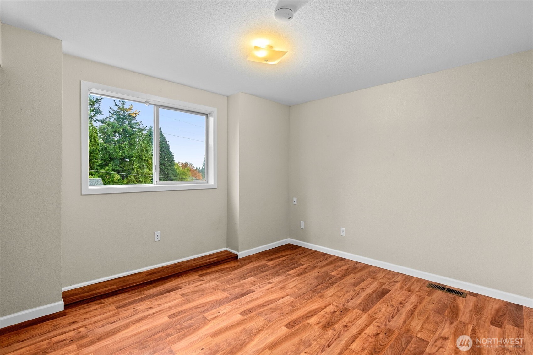 615 Clark Street Southwest Tumwater, WA 98512 - Photo 23 of 27 a view of empty room with wooden floor and fan