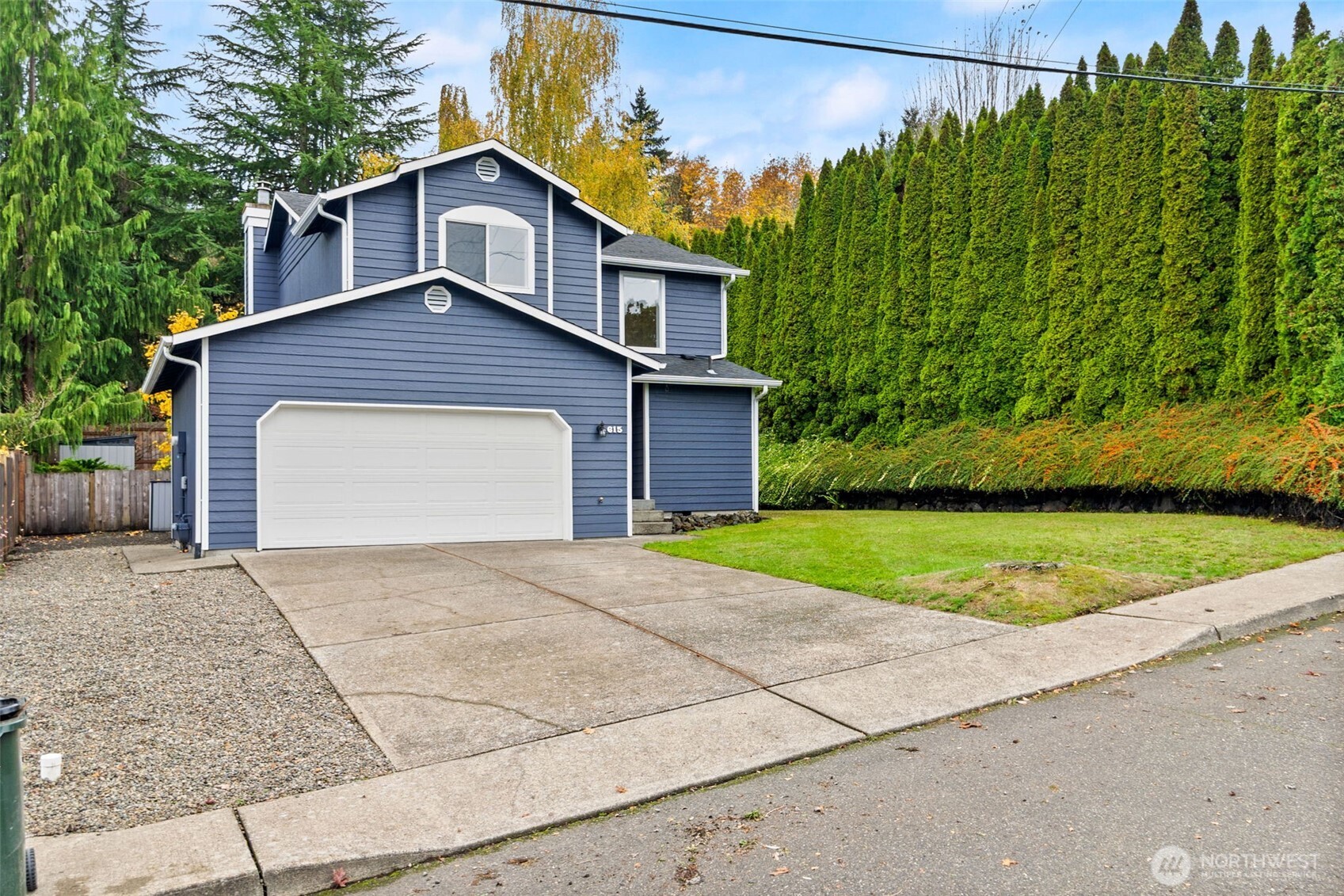 615 Clark Street Southwest Tumwater, WA 98512 - Photo 27 of 27 a front view of a house with a yard and garage