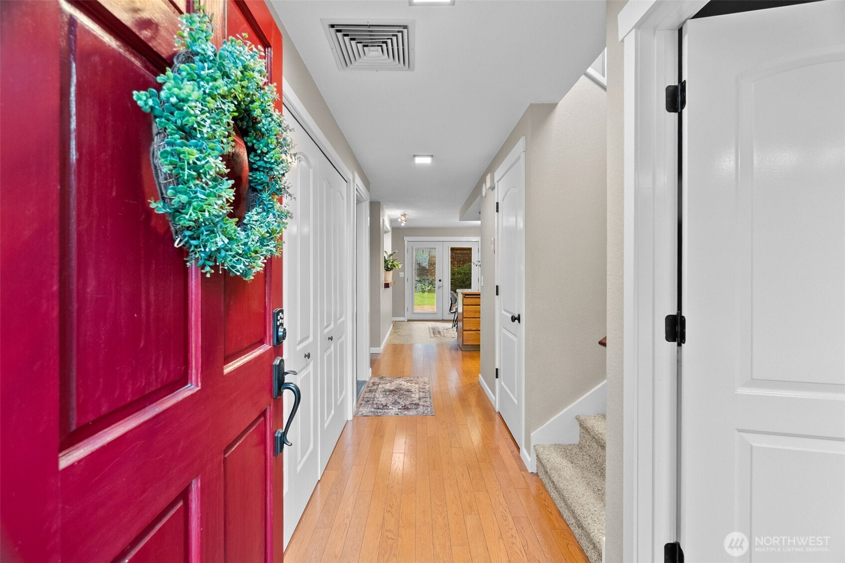 615 Clark Street Southwest Tumwater, WA 98512 - Photo 7 of 27 a view of a hallway with wooden floor and staircase
