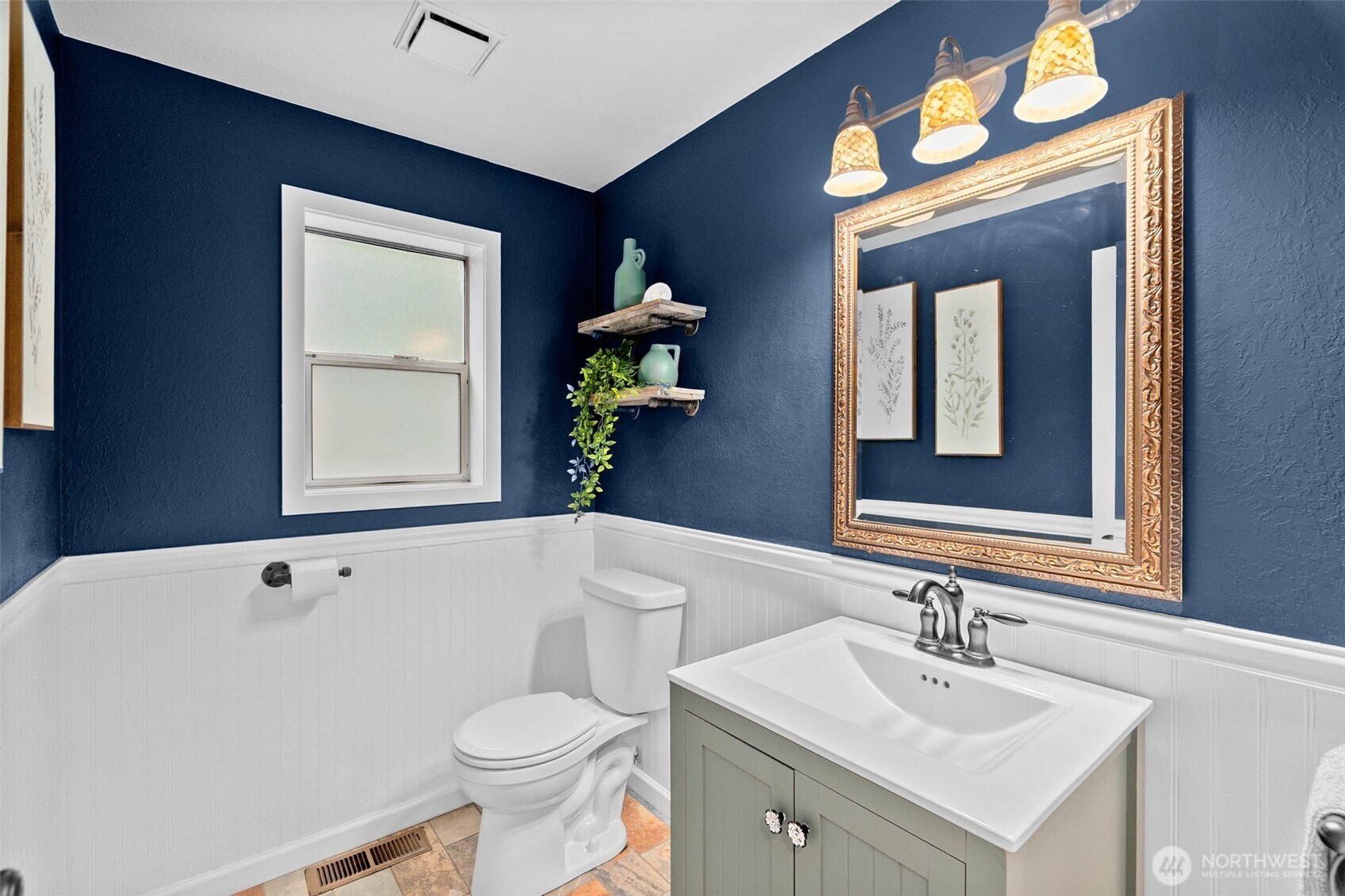 615 Clark Street Southwest Tumwater, WA 98512 - Photo 8 of 27 a bathroom with a sink toilet and mirror