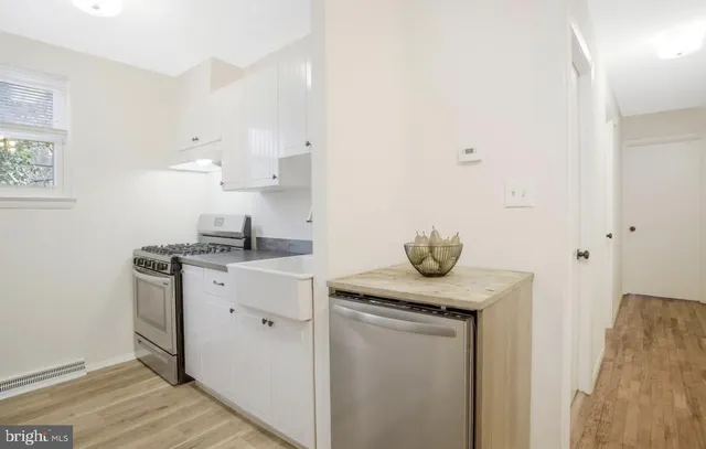 a kitchen with a sink and cabinets