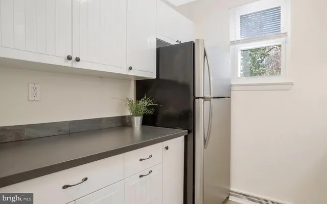 a kitchen with appliances and cabinets