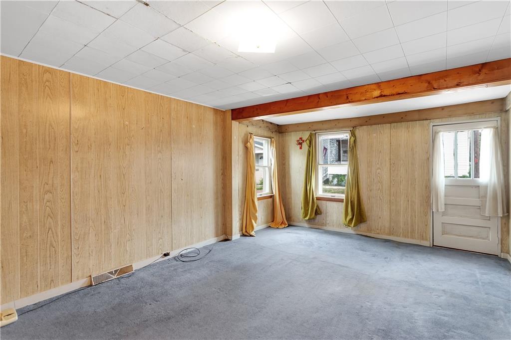 304 Beech Street Vandergrift, PA 15690 - Photo 13 of 25 a view of a livingroom with an empty space and windows