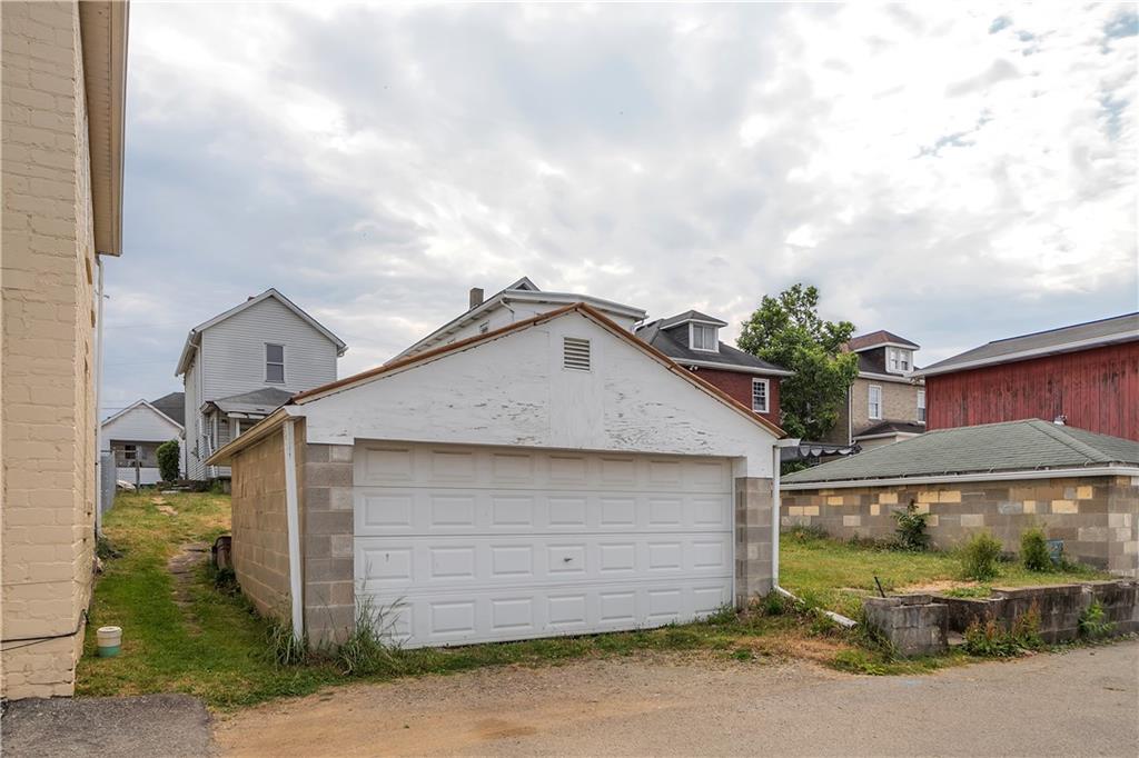 304 Beech Street Vandergrift, PA 15690 - Photo 3 of 25 a front view of a house with a garage
