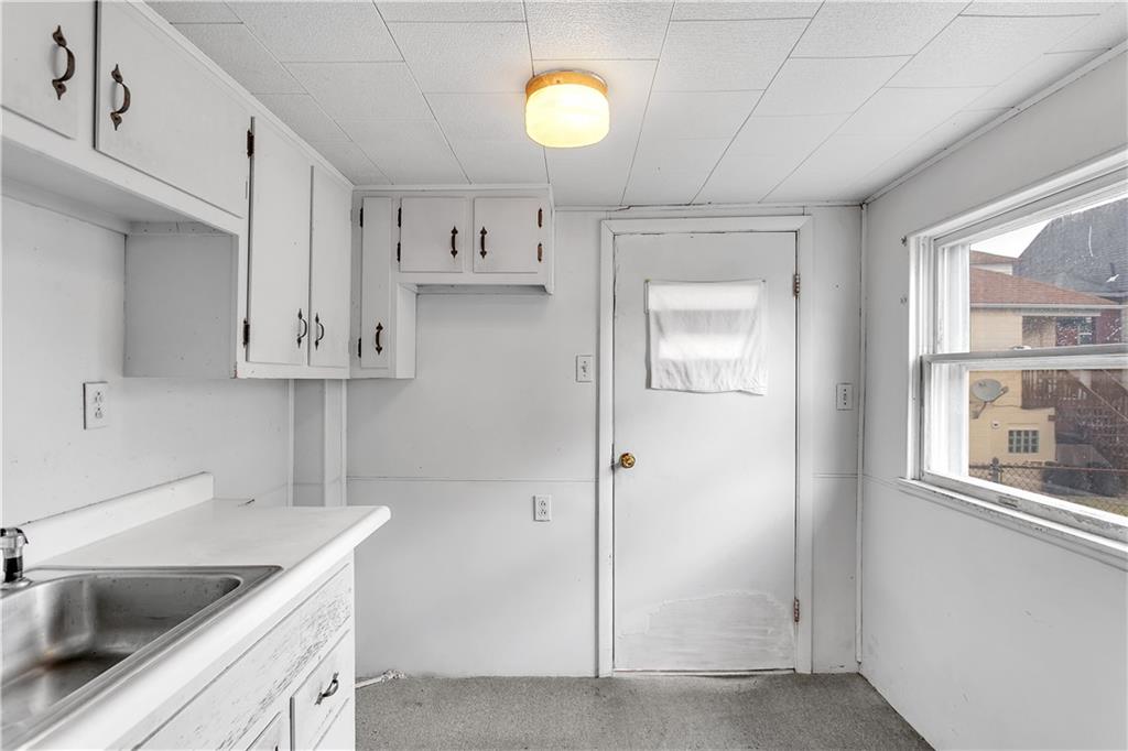 304 Beech Street Vandergrift, PA 15690 - Photo 6 of 25 a kitchen that has a sink and a cabinets