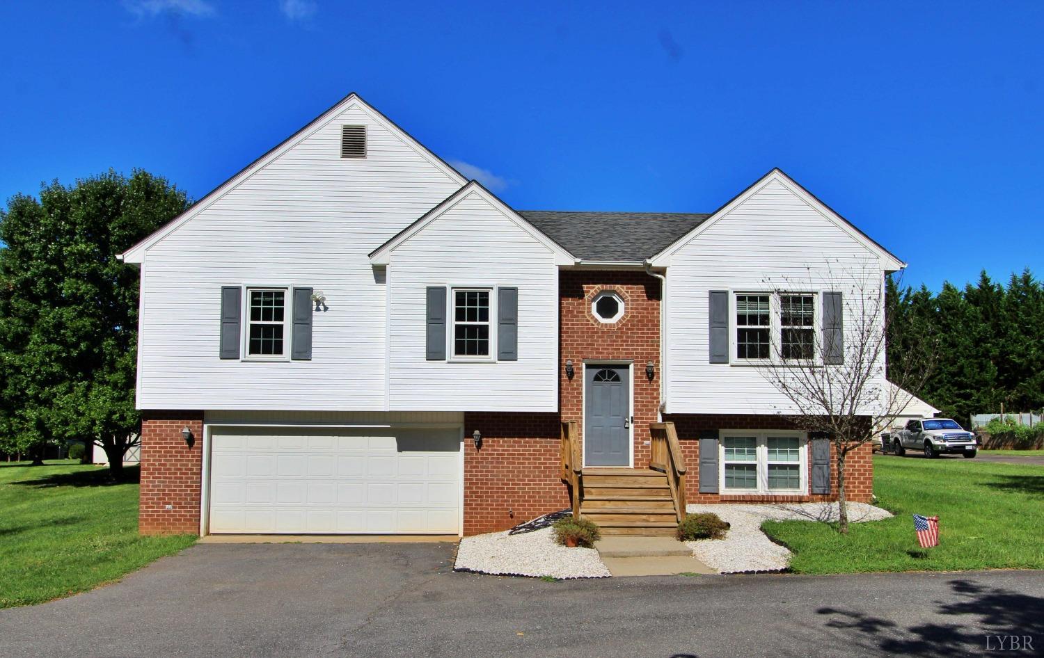2899 Thomas Jefferson Road Forest, VA 24551 - Photo 1 of 22 a front view of a house with a yard