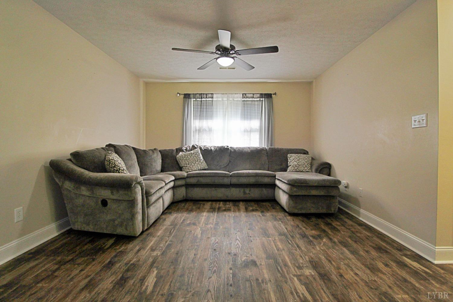 2899 Thomas Jefferson Road Forest, VA 24551 - Photo 13 of 22 a living room with furniture and a wooden floor
