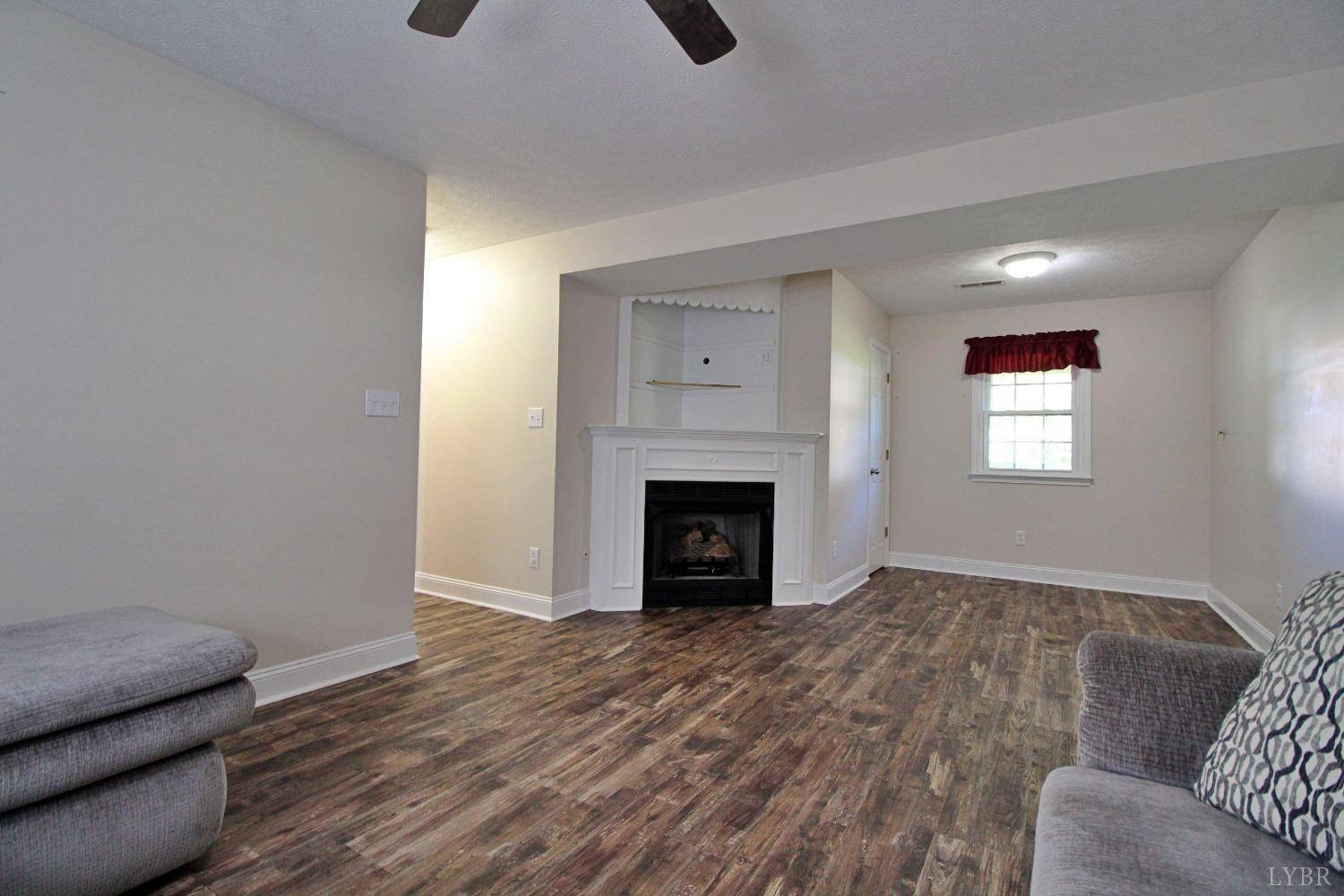 2899 Thomas Jefferson Road Forest, VA 24551 - Photo 14 of 22 a view of livingroom with furniture and fireplace