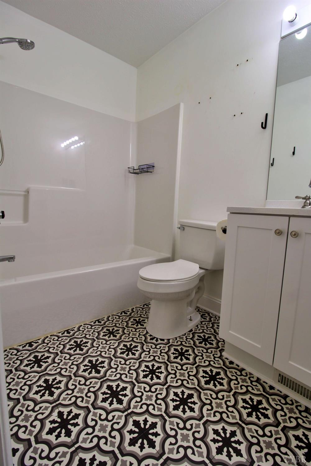 2899 Thomas Jefferson Road Forest, VA 24551 - Photo 6 of 22 a bath room with a toilet a sink and a shower