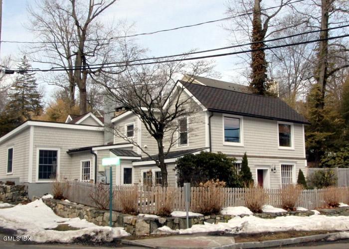 446 Valley Road Cos Cob, CT 06807 - Photo 1 of 9 a front view of a house with a yard