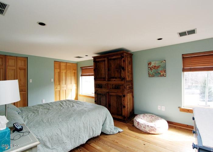 446 Valley Road Cos Cob, CT 06807 - Photo 5 of 9 a bedroom with a bed and a dresser