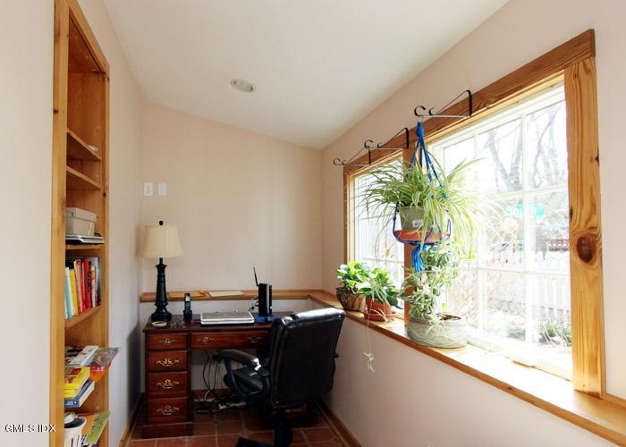 446 Valley Road Cos Cob, CT 06807 - Photo 8 of 9 a view of a workspace with furniture and a window