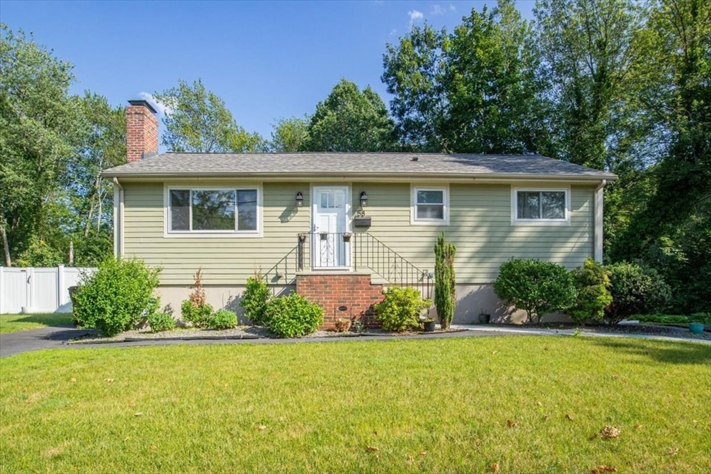 front view of a house with a yard