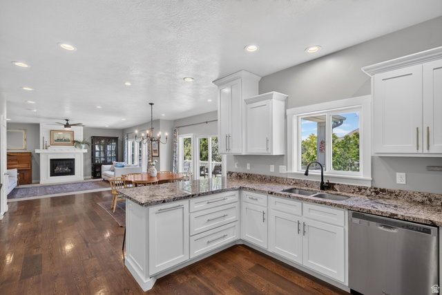 1263 East 1200th South Springville, UT 84663 - Photo 10 of 60 Kitchen featuring white shaker cabinetry, speckled countertops, a stainless steel double-basin sink with a matte black faucet, and stainless steel appliances