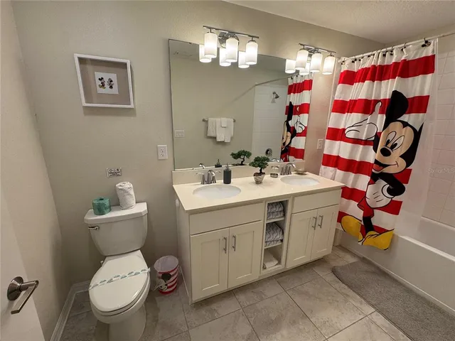 a utility room with cabinets washer and dryer