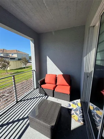 an aerial view of a house with a swimming pool yard and outdoor seating