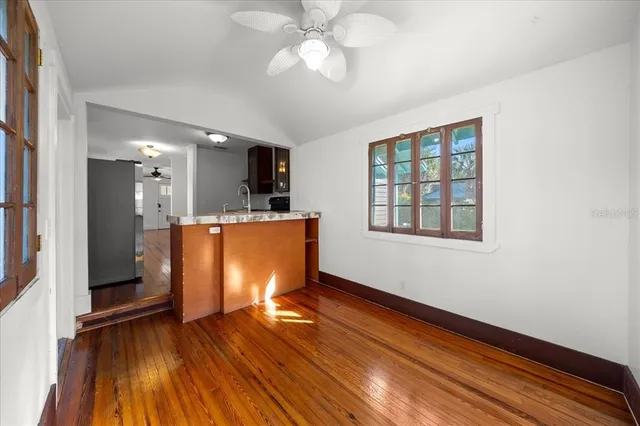 a view of kitchen with cabinets and wooden floor