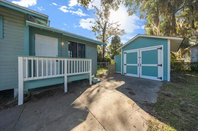 a view of backyard with a garden and deck
