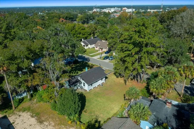 an aerial view of a house with a yard