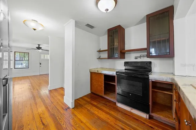 a kitchen with a sink and a stove top oven