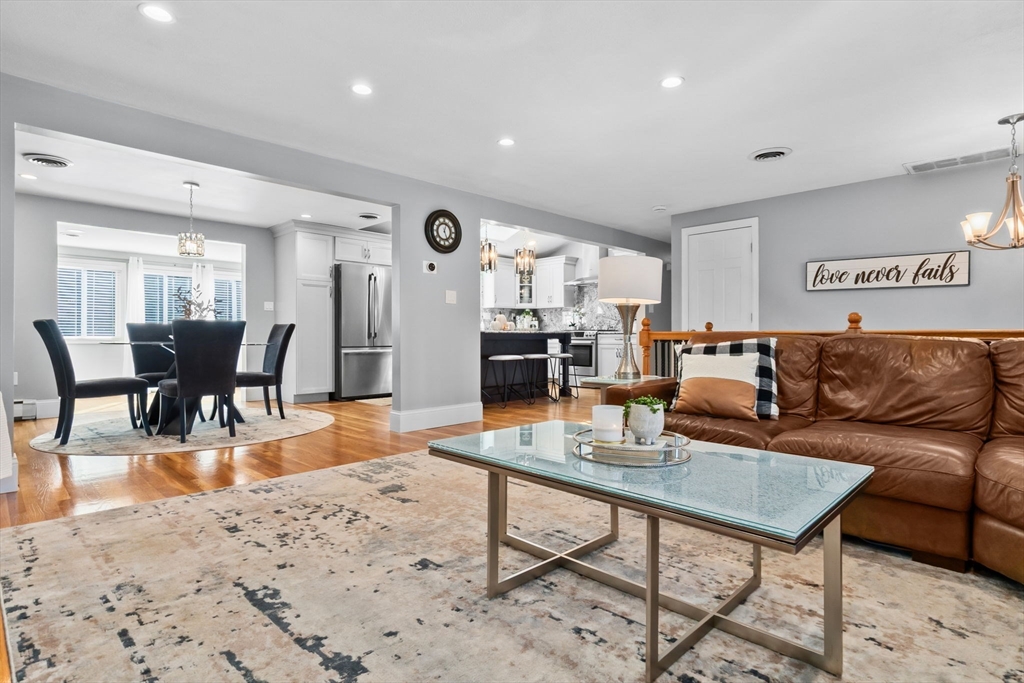 6 Susan Drive Saugus, MA 01906 - Photo 12 of 34 a living room with furniture a dining table and wooden floor