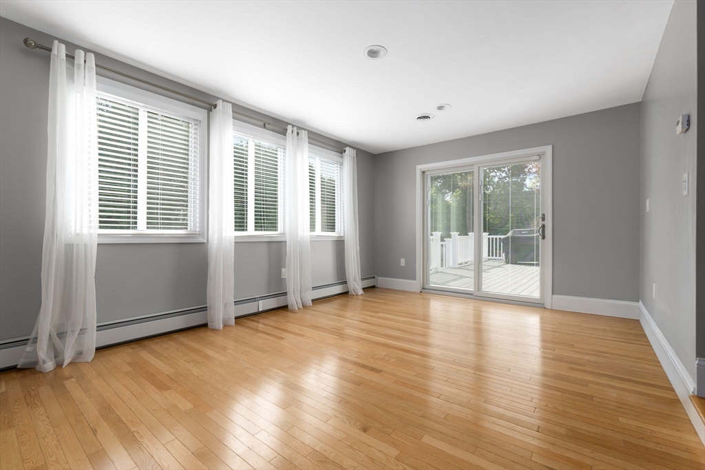 6 Susan Drive Saugus, MA 01906 - Photo 14 of 34 an empty room with wooden floor and windows
