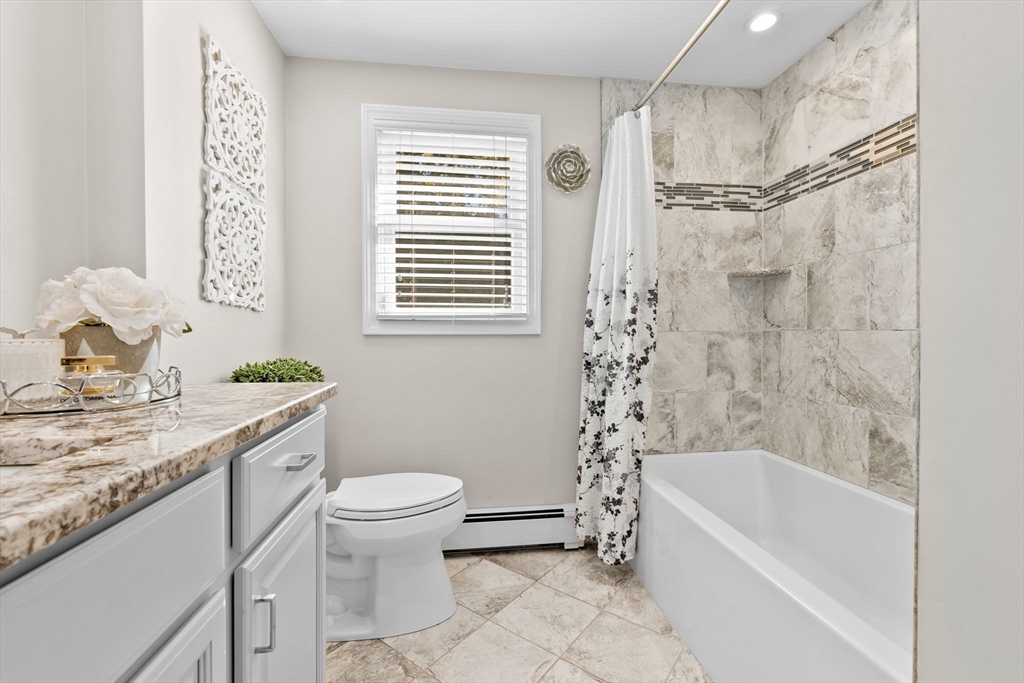 6 Susan Drive Saugus, MA 01906 - Photo 15 of 34 a bathroom with a granite countertop sink a toilet and shower