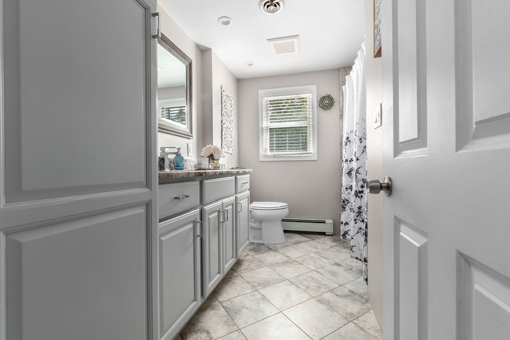 6 Susan Drive Saugus, MA 01906 - Photo 16 of 34 a bathroom with a sink a toilet and a window