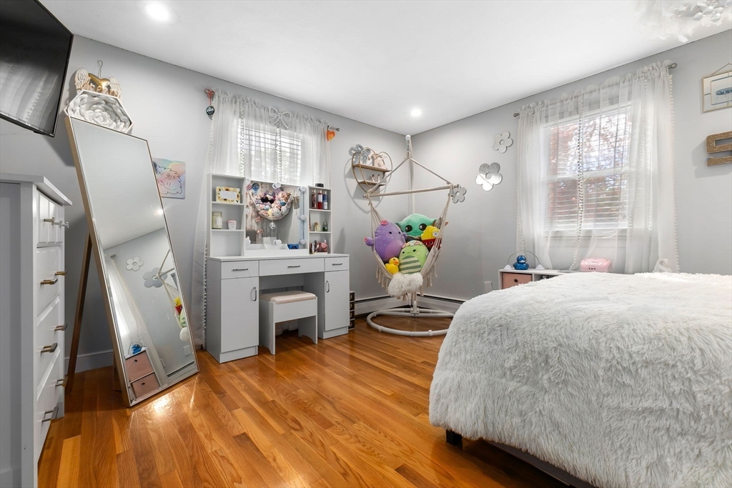 6 Susan Drive Saugus, MA 01906 - Photo 19 of 34 a living room with furniture and a fireplace