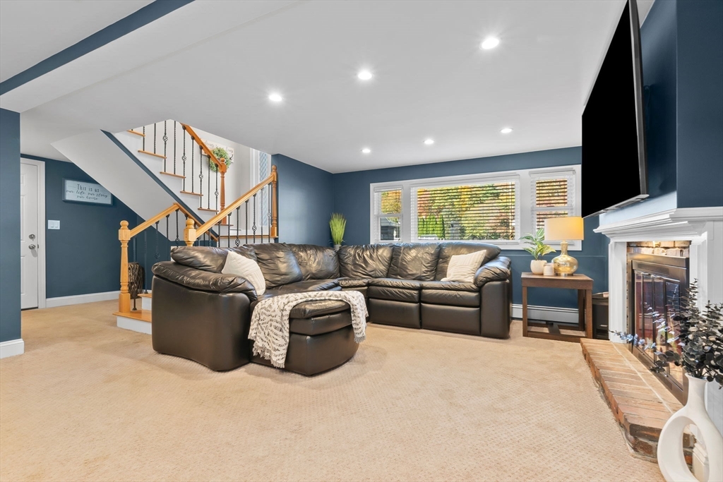 6 Susan Drive Saugus, MA 01906 - Photo 25 of 34 a living room with furniture fireplace and flat screen tv