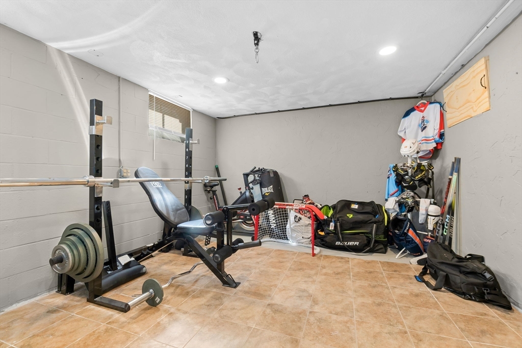 6 Susan Drive Saugus, MA 01906 - Photo 29 of 34 a view of a workspace with furniture and a potted plant