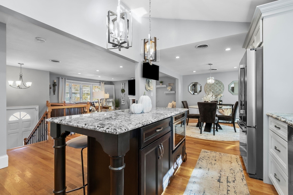 6 Susan Drive Saugus, MA 01906 - Photo 6 of 34 a dining hall with stainless steel appliances granite countertop furniture wooden floor and a counter top space