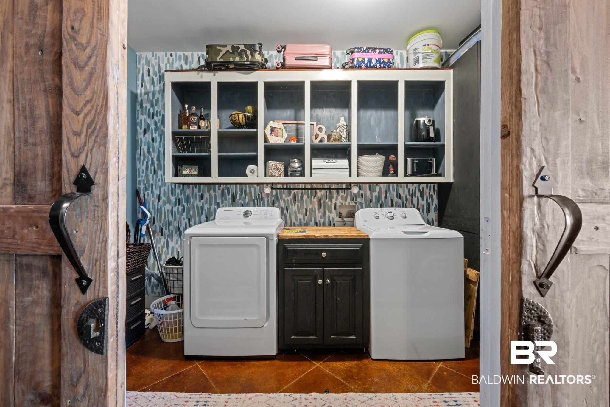 15635 North A N Brady Road Bay Minette, AL 36507 - Photo 18 of 51 Clothes washing area featuring cabinets and dark tile patterned flooring