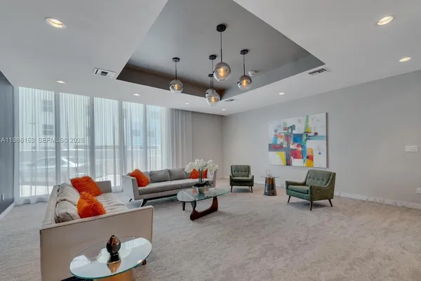 a living room with furniture and a window