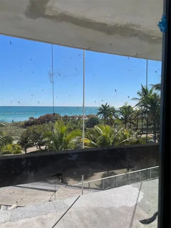 a view of outdoor space and blue kitchen area