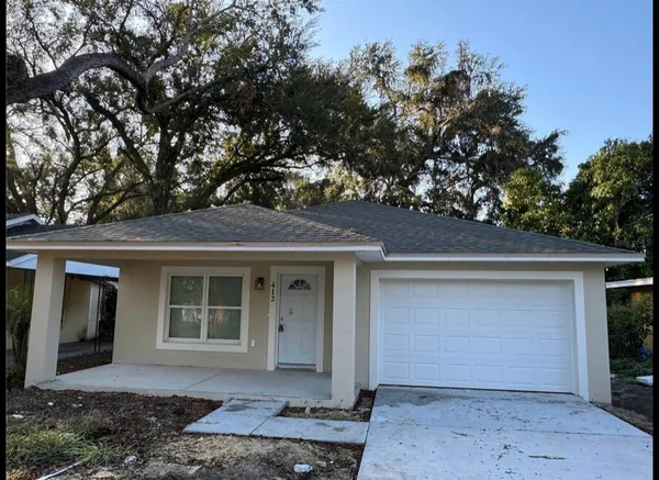 front view of a house with a yard