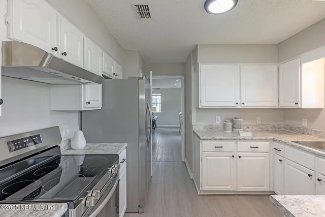 a bathroom with a shower and toilet