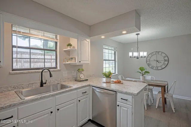 a kitchen with sink and window