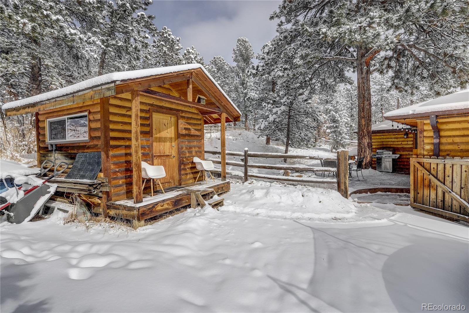 1094 Colorow Road Golden, CO 80401 - Photo 11 of 40 a view of backyard with a deck and wooden fence