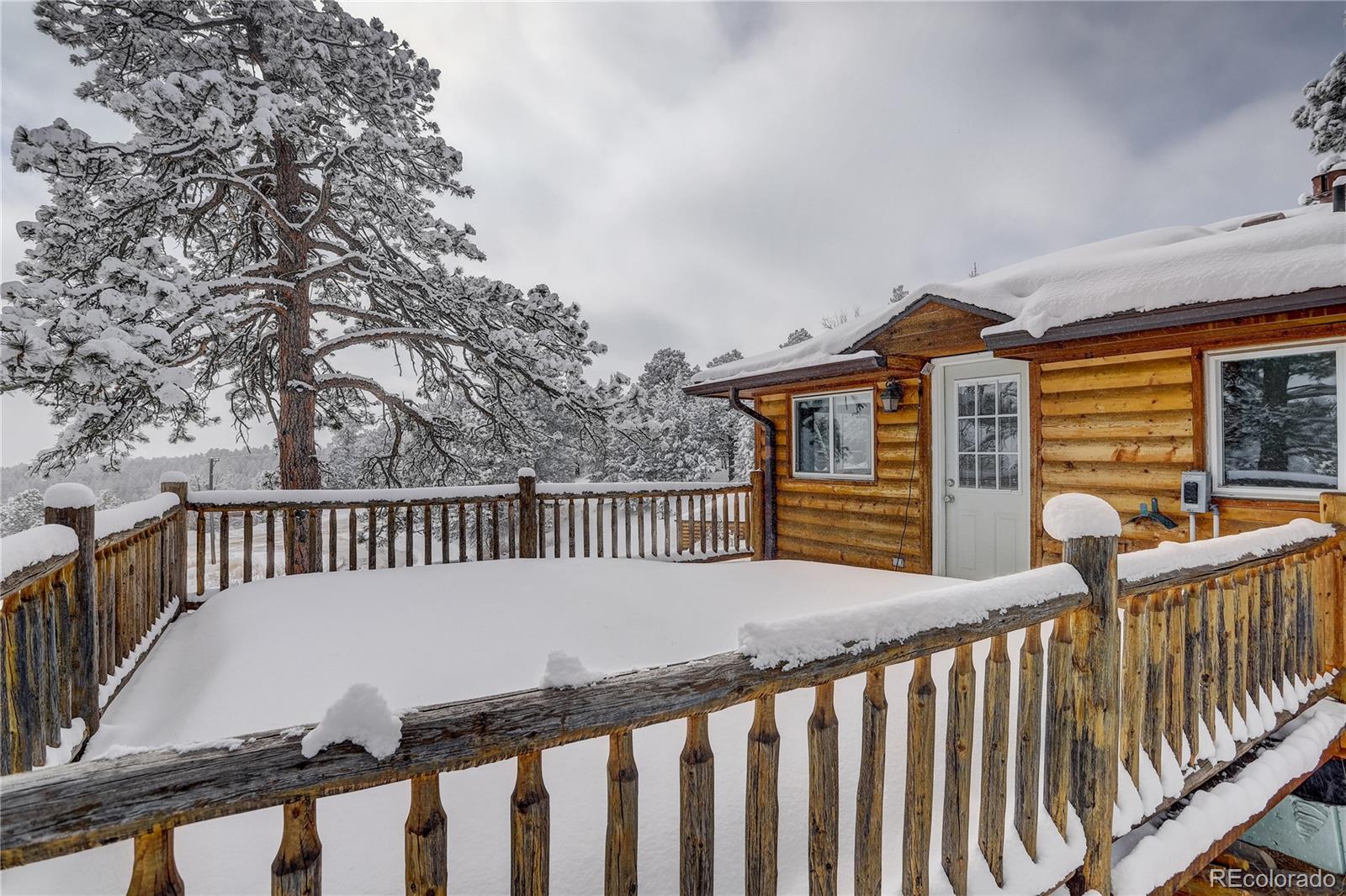 1094 Colorow Road Golden, CO 80401 - Photo 22 of 40 a view of a roof deck with wooden fence and floor