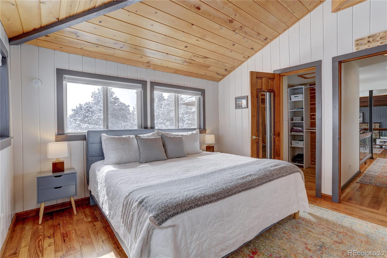 1094 Colorow Road Golden, CO 80401 - Photo 23 of 40 a large bed sitting in a bedroom next to a window