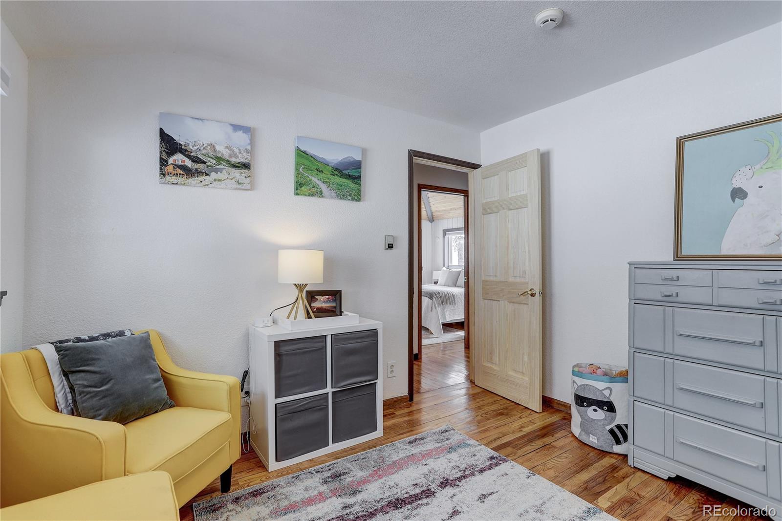 1094 Colorow Road Golden, CO 80401 - Photo 27 of 40 a living room with a bed and furniture