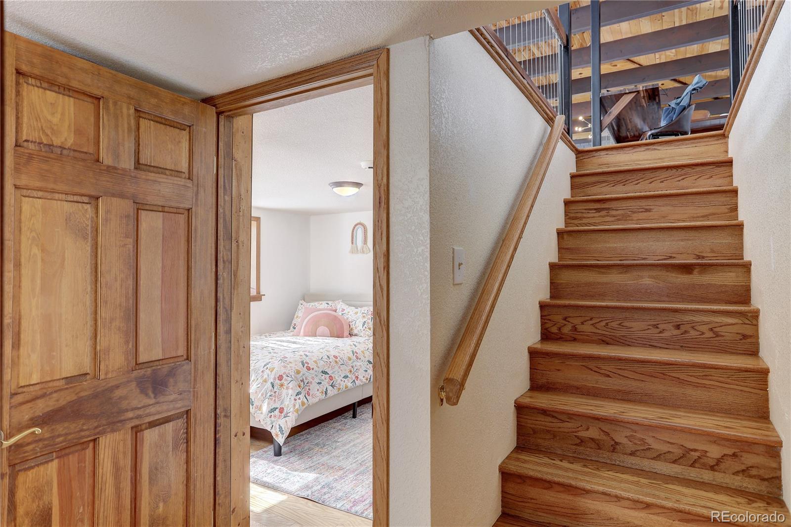 1094 Colorow Road Golden, CO 80401 - Photo 30 of 40 a view of entryway and hall with wooden floor
