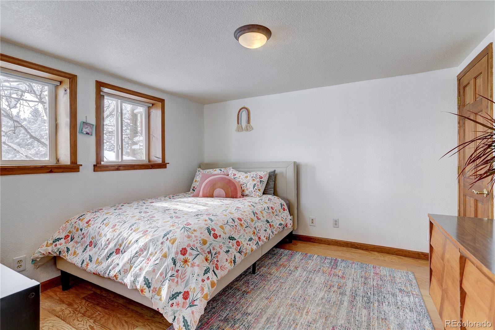 1094 Colorow Road Golden, CO 80401 - Photo 31 of 40 a bedroom with a bed and a window